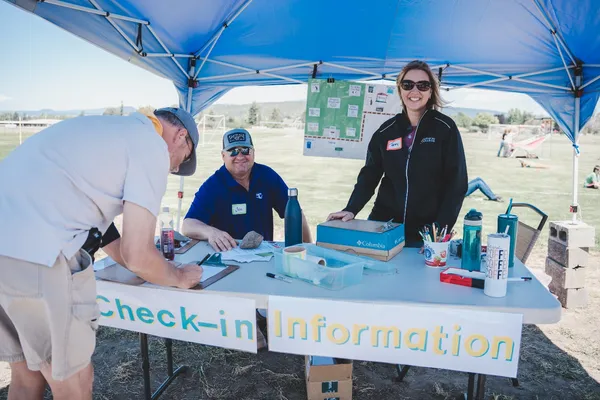 Volunteers running a check-in table.