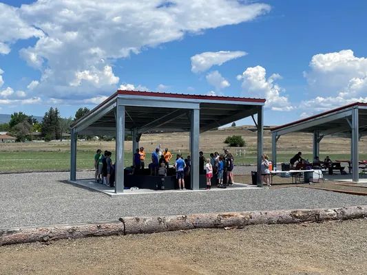 Youth gathered under a covered area.