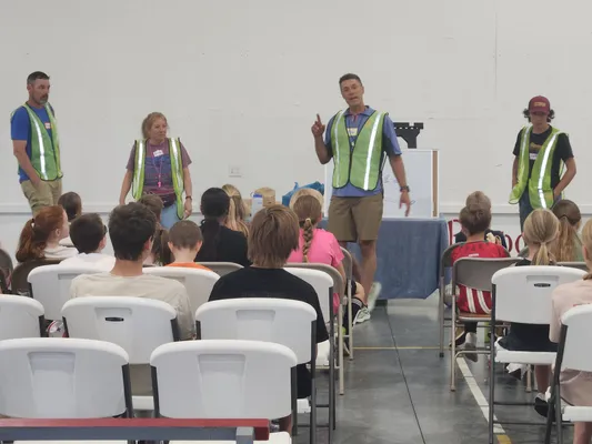 Camp coaches and volunteers introducing themselves to seated campers