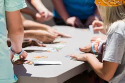 Youth working on arts and crafts at a table