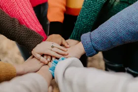 Youth in an outdoor huddle