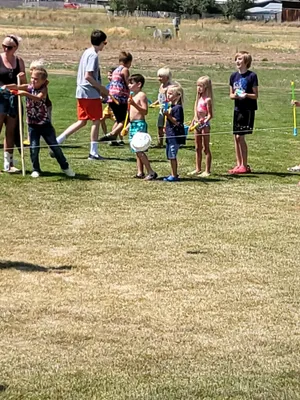 Youth in line playing with water