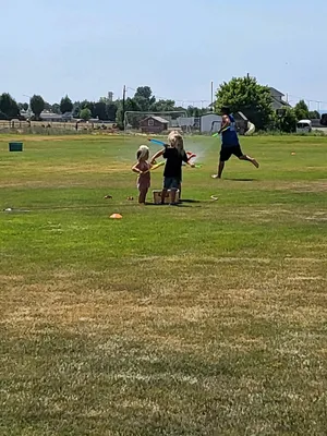 Toddlers playing with water.